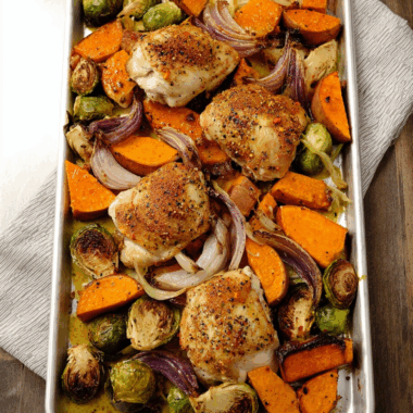 Crispy Chicken Thighs and Roasted Veggies Drizzled in Tangy Mustard Vinaigrette