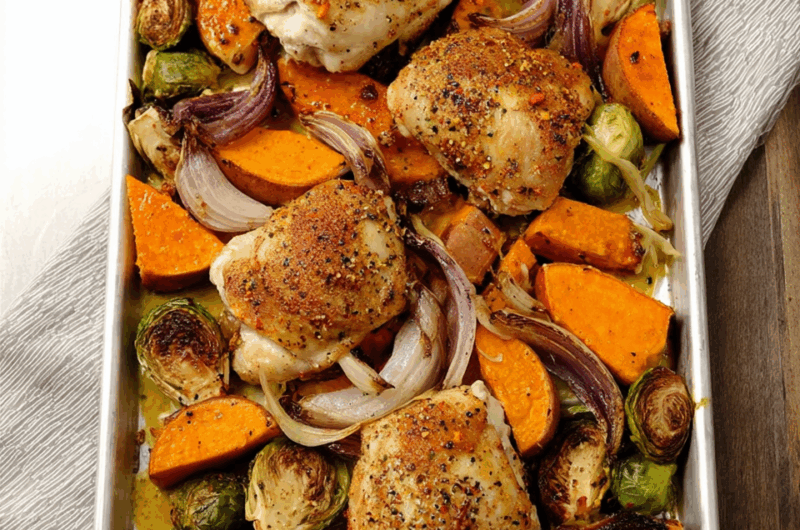 Crispy Chicken Thighs and Roasted Veggies Drizzled in Tangy Mustard Vinaigrette