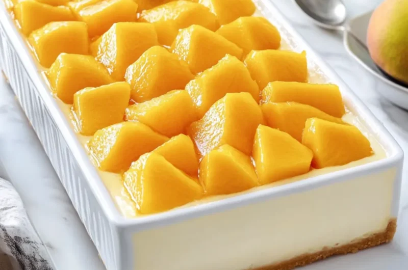 Creamy Mango Cheesecake in a White Rectangular Casserole
